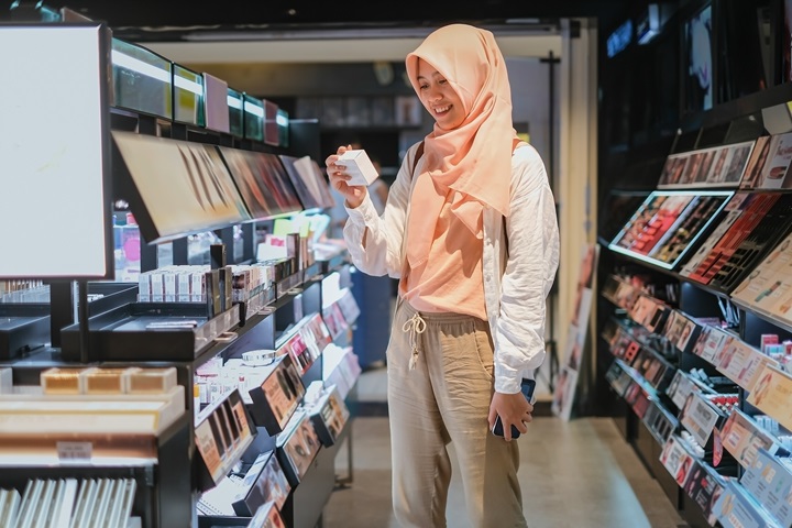 Muslim Indonesian Woman Shopping Make up at Department Store